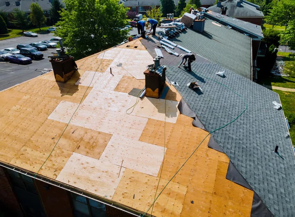 Aerial view of roof replacement in progress by Peak Roofing